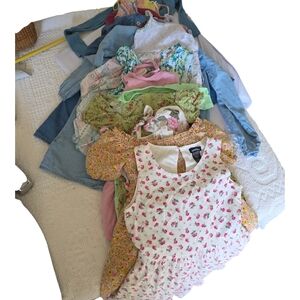 A Bundle Of 14 Girls Floral Dress Collection in Pink, Yellow, and Green.